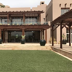 artificial grass cost per sq ft - hotel courtyard 