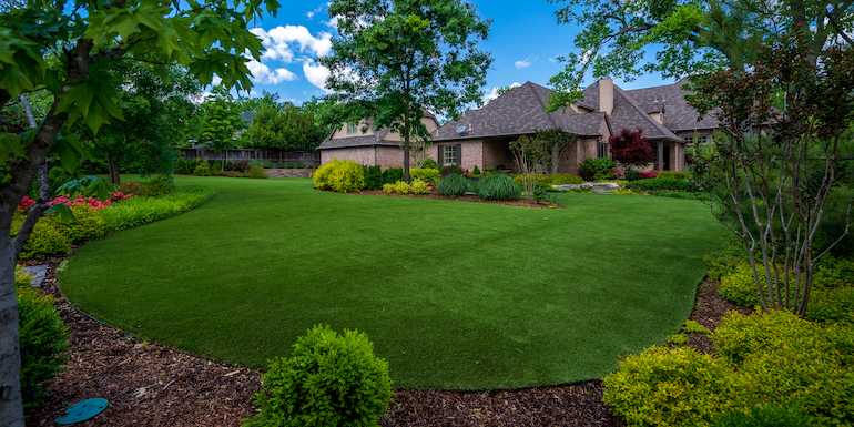 Largent residence backyard featuring ForeverLawn Landscape artificial grass warranty